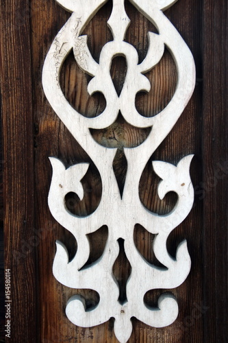 White Russian traditional ornament on wooden wall