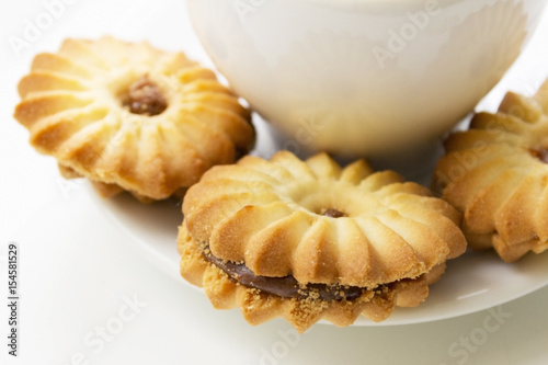 Cookies close-up on a background of a cup of coffee