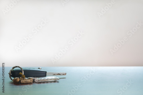 Car key isolated on the wooden table