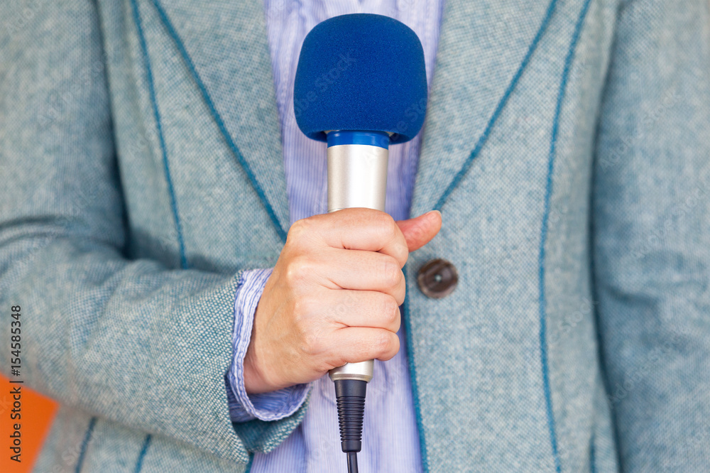 Fototapeta premium News reporting. Journalist. Microphone.