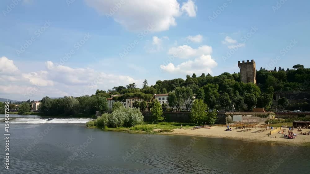 Beach at Arno river with view at porta san niccolo Beach at Arno river with view at porta san niccolo