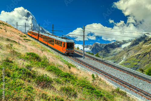 Electric tourist train and Matterhorn peak near Zermatt, Switzerland, Europe