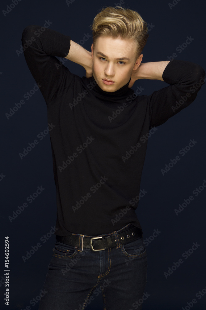 Attractive young guy posing in studio, blond hair Attractive young guy posing in studio, blond hair