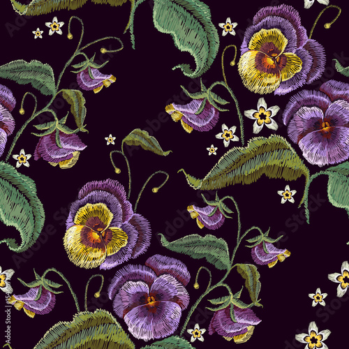 Violets flower embroidery seamless pattern.  Classical embroidery beautiful flowers of violet on black seamless background.  Fashionable template design of clothes