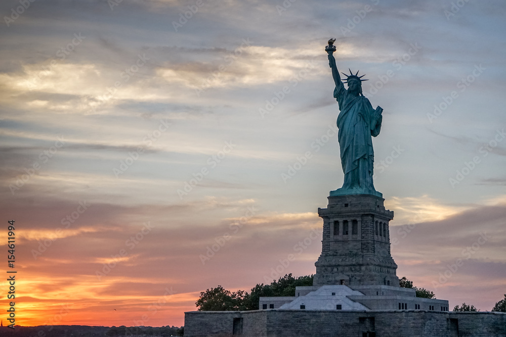Liberty statue and sunset in New York.
