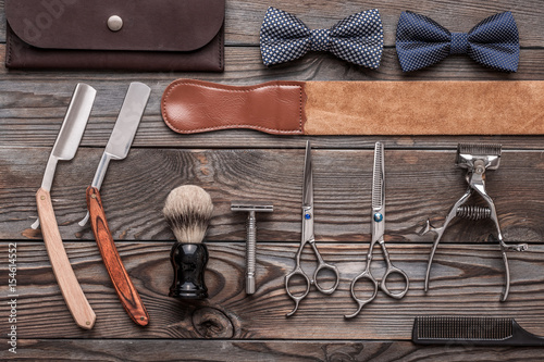 Vintage barber shop tools on wooden background