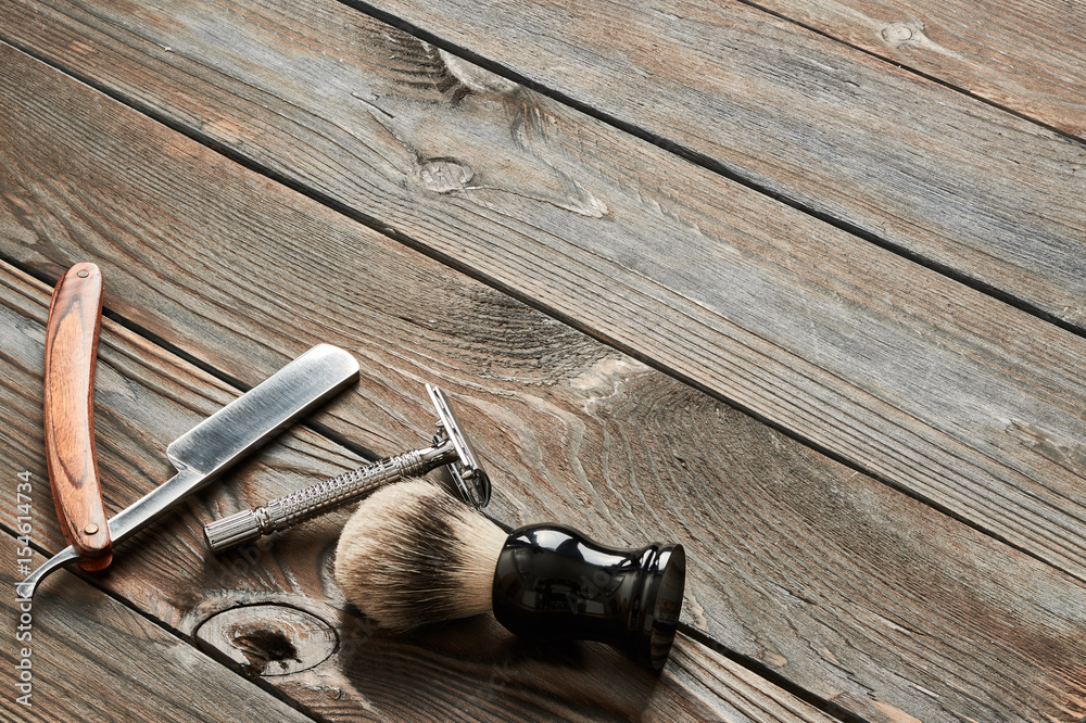 Vintage barber shop tools on wooden background