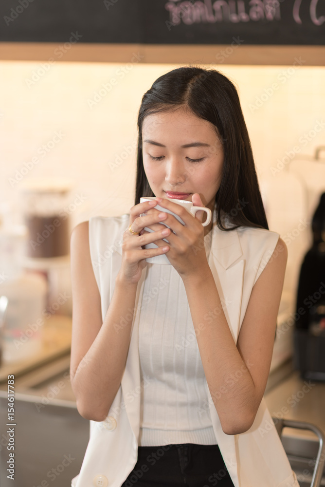 Young women drinking coffee at a cafe Young women drinking coffee at a cafe
