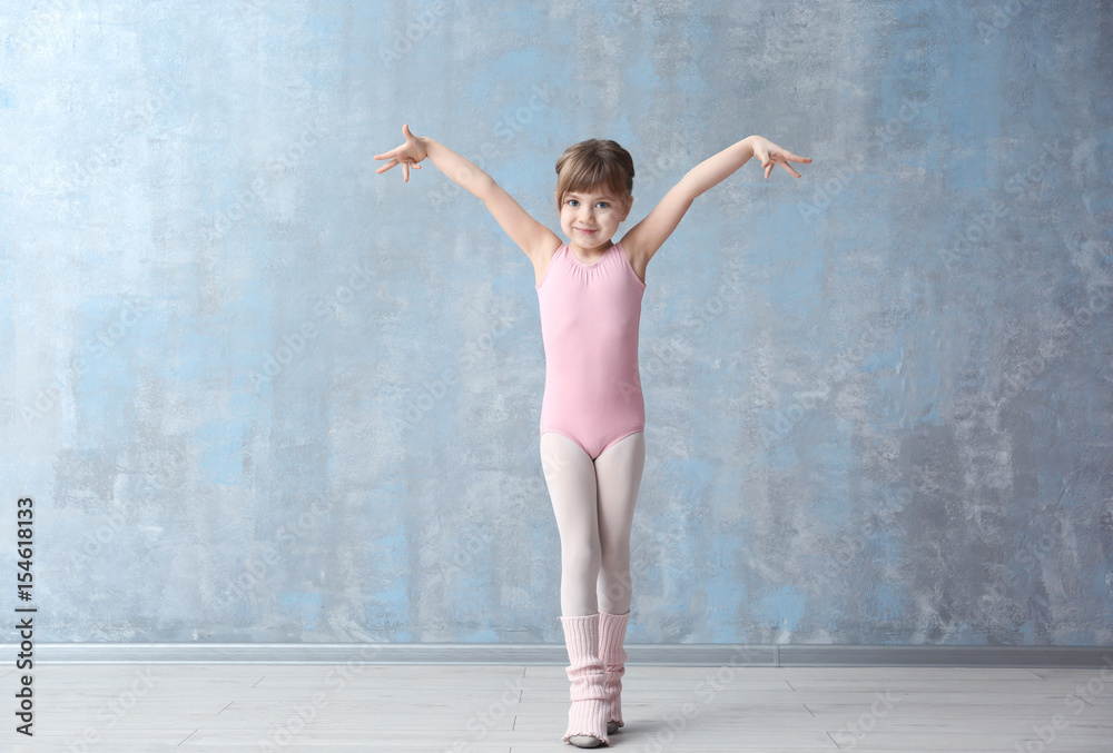 Fototapeta premium Cute little ballerina in dance studio