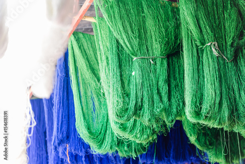 Fresh painted in green and blu colour sheep wool photo