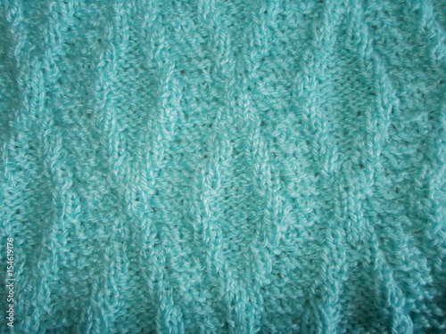 
Blue knitted texture with a rhomb pattern
