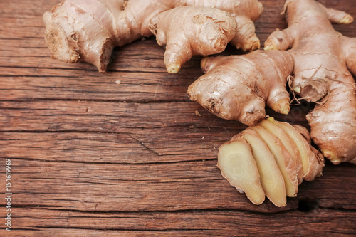 Ginger root sliced on wooden table