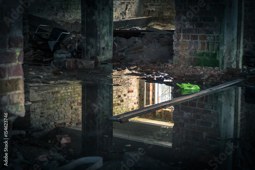 The view from an old, abandoned factory in inside with nice reflection and window light
