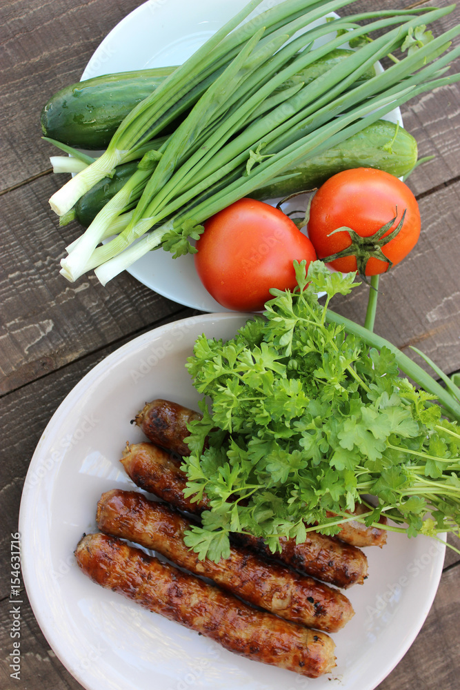 Grilled sausages on the coals Grilled sausages on the coals