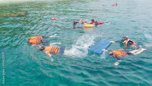 Tourists are snorkelling at Zedetkyikyun Island at Myanmar