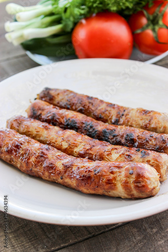 Grilled sausages on the coals