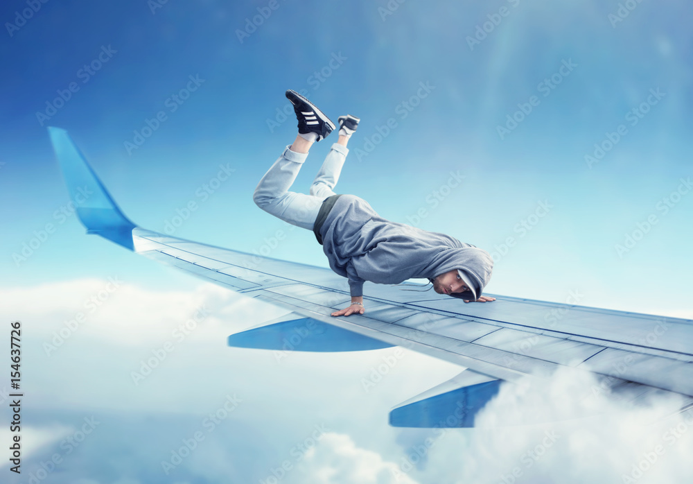 Dance performer, dancing exercise on plane wing Dance performer, dancing exercise on plane wing