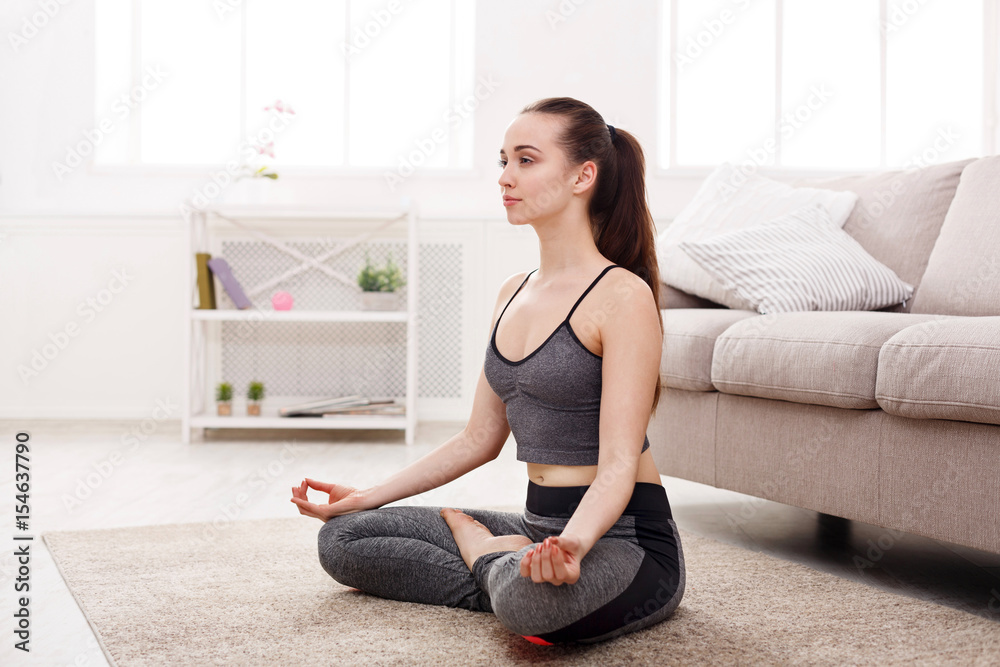 Yoga at home, woman do lotus pose