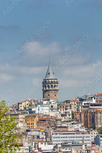 View of medieval stone Galata Tower in the Galata/Karakoy quarter of Istanbul from the Bosphorus. Turkey.
