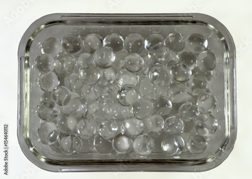 Silicone balls in a rectangular glass bowl photo