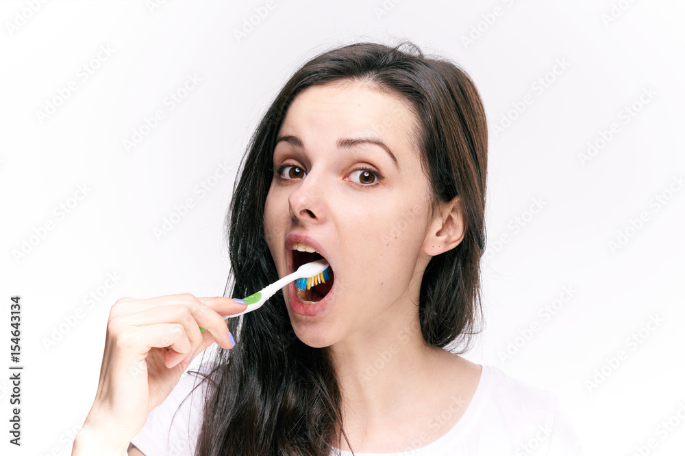 the woman opened her mouth wide, a toothbrush, morning exercises the woman opened her mouth wide, a toothbrush, morning exercises