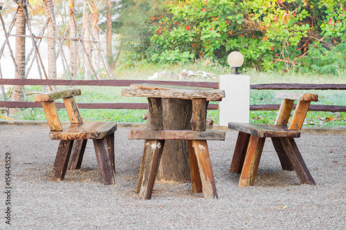 group of wood desk and chairs in park © dadatop