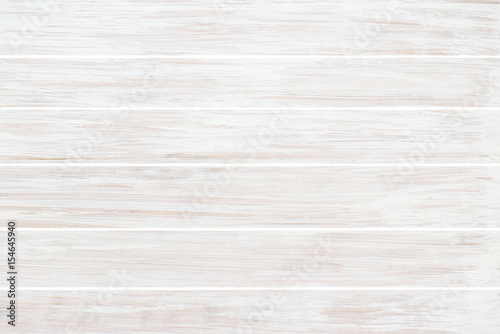 Background of old wooden weathered board painted white. Stripes plank pattern for texture use.