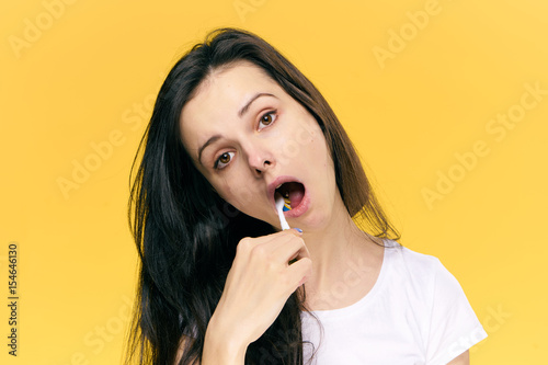 woman thoroughly cleans teeth, mouth