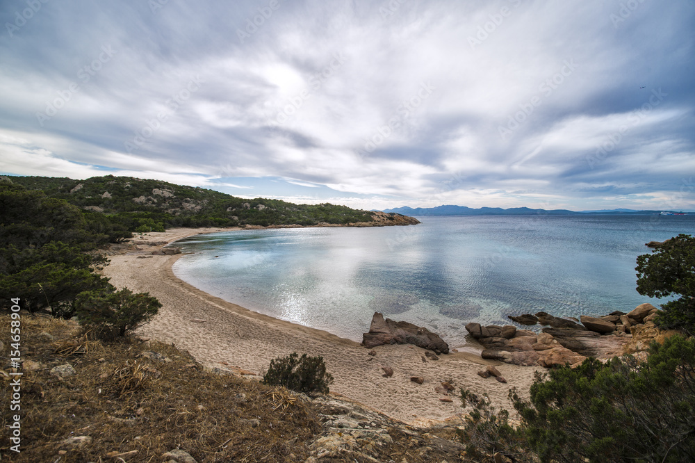 Amazing seascape of a turquoise sea in Italy. Beautiful wild beach of the Emerald coast in Sardinia..