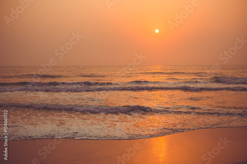 Fototapeta Naklejka Na Ścianę i Meble -  Colorful sunset over the ocean Vagator Beach, south Goa, India.
