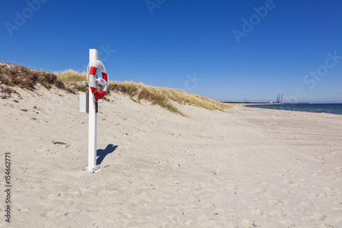 Fototapeta Naklejka Na Ścianę i Meble -  Lifebelt at Baltic Sea beach of Grenaa, Denmark