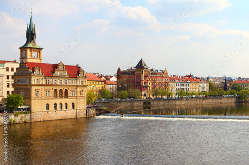 Old Town ancient architecture and Vltava river pier in Prague