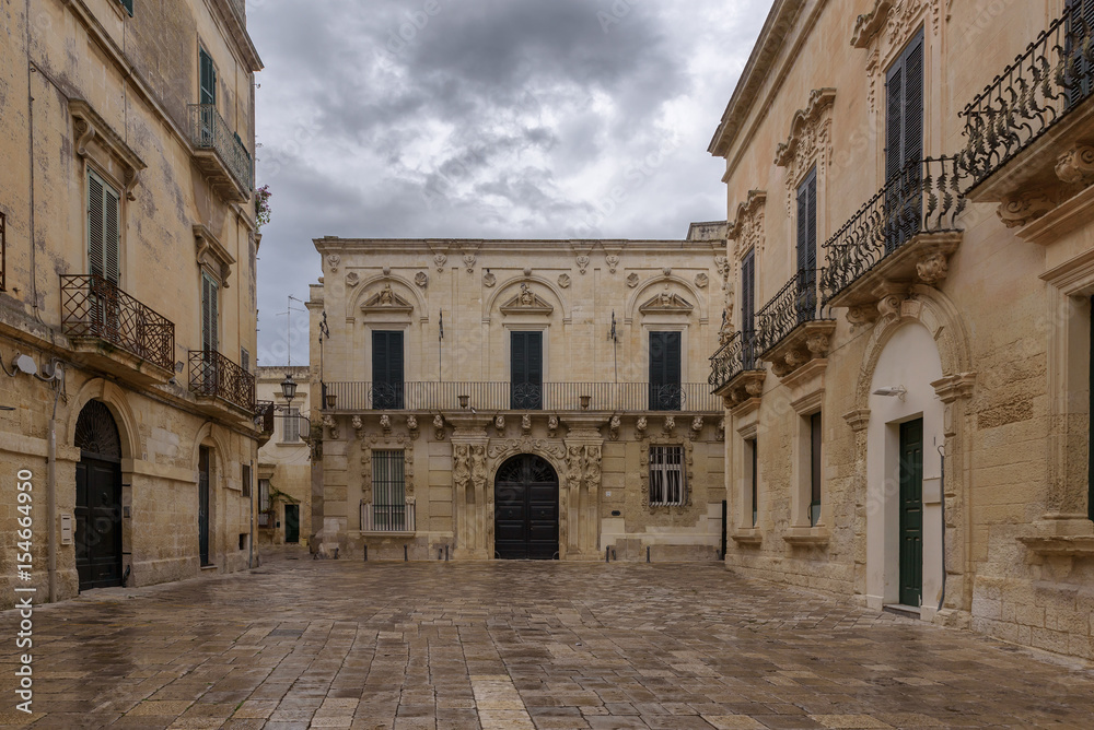 Baroque houses in Piazzetta Ignazio Falconieri on a rainy day, historic center of Lecce, Puglia, Italy