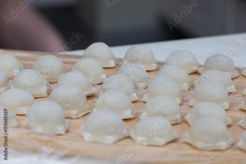 The process of making dumplings in the kitchen.