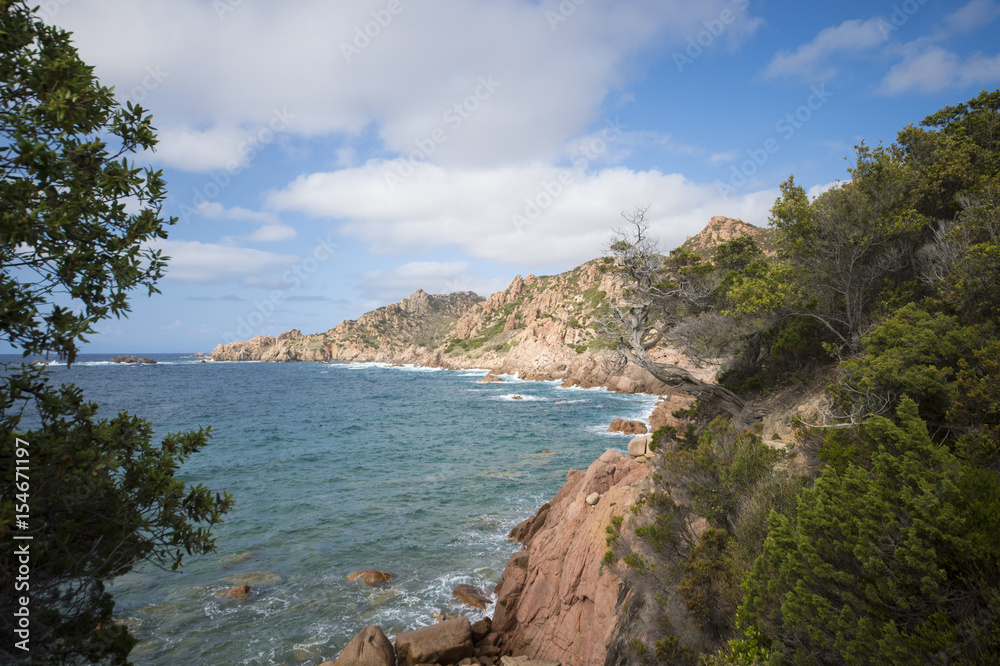 Fototapeta premium Amazing seascape of a turquoise sea in Italy. Beautiful wild beach of the Emerald coast in Sardinia..