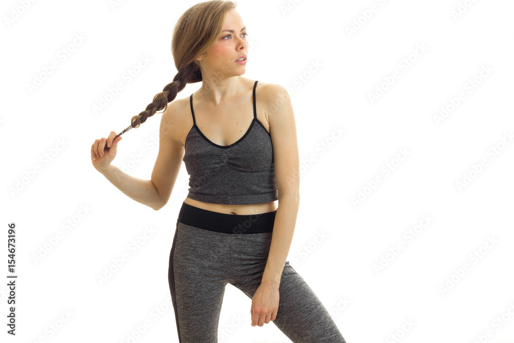 attractive young blonde poses on cam in a gray sport suit and keeps hand pigtail attractive young blonde poses on cam in a gray sport suit and keeps hand pigtail