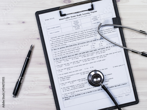 Insurance contract and stethoscope