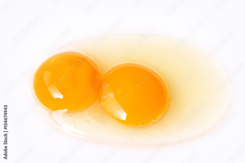 Fresh egg twins on white background, ready for the cooking.