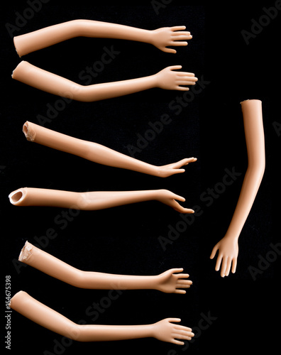 Broken Doll Arms and Hands on Black Background