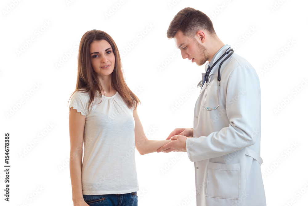 smiling young girl came to the doctor and he makes her vaccinated on hand smiling young girl came to the doctor and he makes her vaccinated on hand