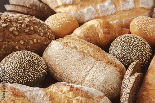 Bread background, closeup of white, black and rye loaves