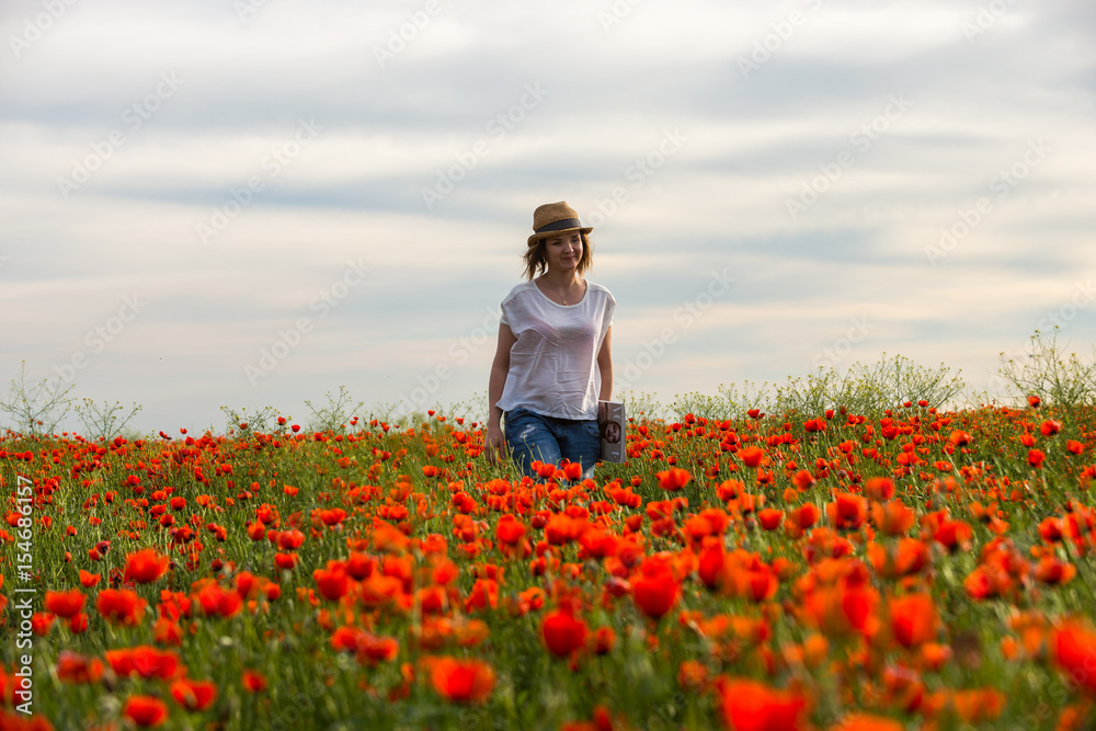 Fototapeta premium Poppy flower and girl