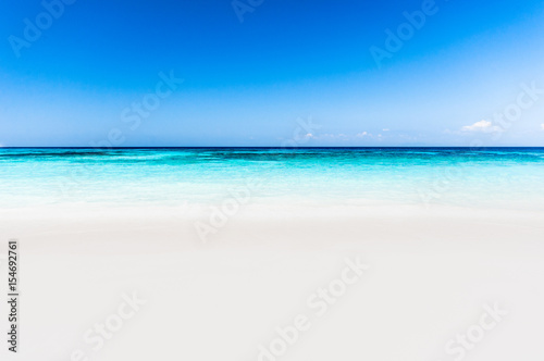 Beautiful tropical beach, white sand and blue sky background. © BBandSIRI