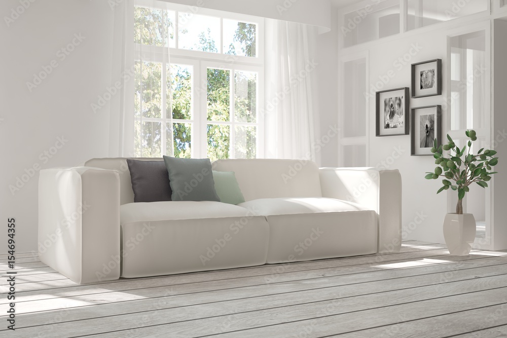 Fototapeta premium White room with sofa and green landscape in window. Scandinavian interior design. 3D illustration