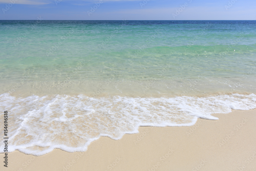 White beach, wave and summer tropical sea background.