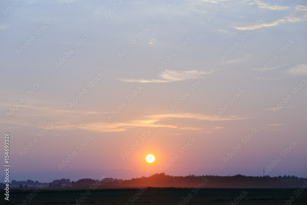 sunset over the fields in a horizont