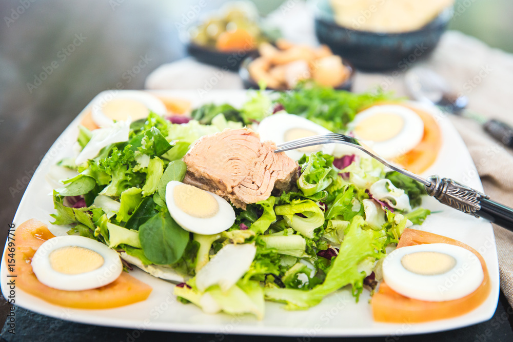 Fresh summer salad with eggs and tuna