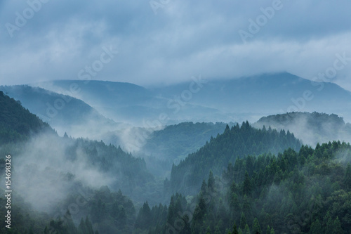 Beautiful mountain range covered with fog and rain in Yufuin, Oita, Japan © kanonsky