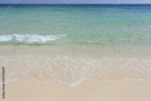 White beach, wave and summer tropical sea background.