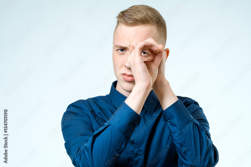 Young man looking far away isolated on white Young man looking far away isolated on white